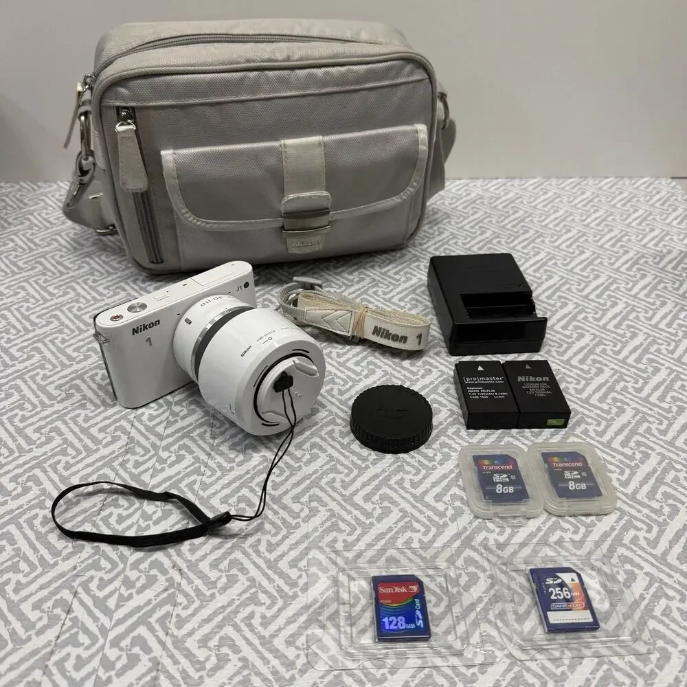 Nikon 1 J1 10.1MP White Camera Bundle - 10-30mm & 30-110mm VR Lenses SD Bag Case